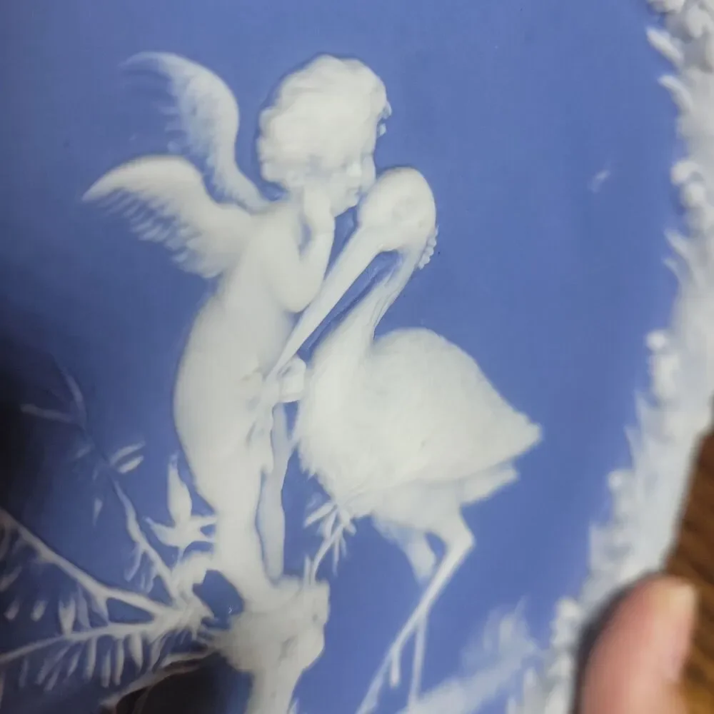 Schafer & Vater Blue & White Jasperware Plaque Featuring a Cherub & Stork Lily